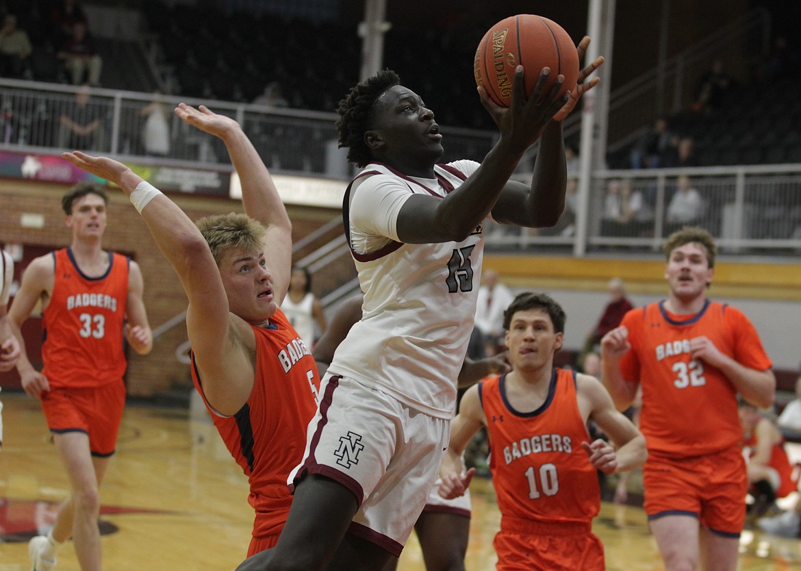 JASON ELLIOTT/Press North Idaho College freshman forward Austin Ouko drives to the basket during the second half of Saturday's Scenic West Athletic Conference game against Snow at Rolly Williams Court.