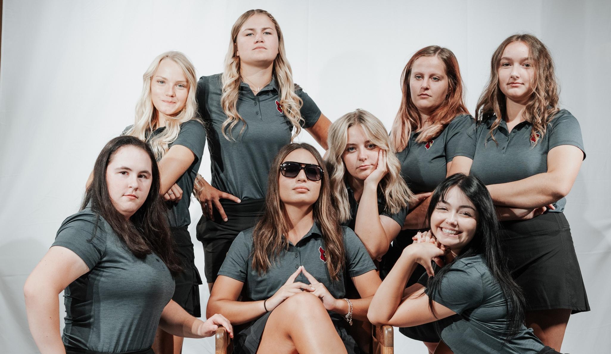 Women's golf team poses for photo on media day.