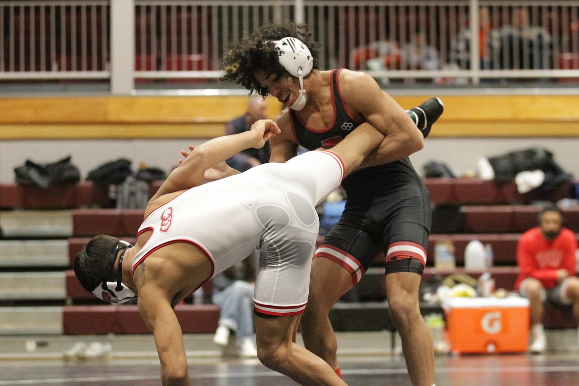 JASON ELLIOTT/Press North Idaho College sophomore Elijah Cater attempts to take down Ane'e Vigil of Clackamas during the 125-pound Championship match at the Region 18 wrestling championships on Sunday at Christianson Gymnasium.