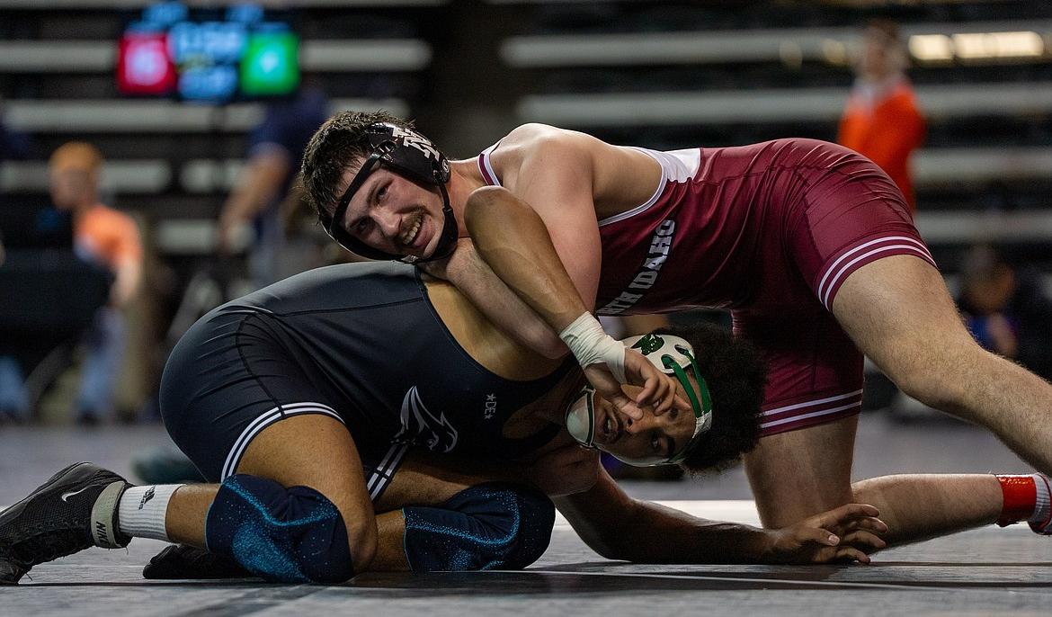 NIC ATHLETICS North Idaho College freshman Seth Martin battles with Matteo Monteiro Furtado Tresse in the Round of 16 in the NJCAA wrestling championships at the Mid-American Center in Council Bluffs, Iowa, on Friday.