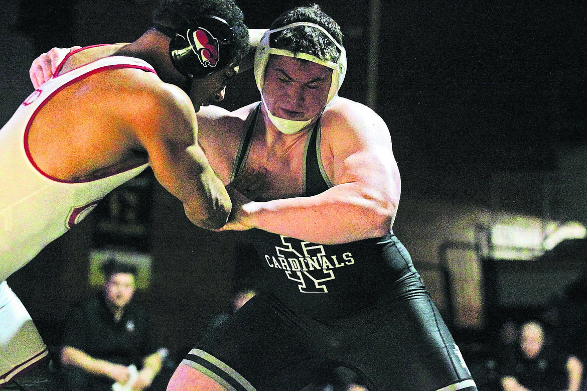 JASON ELLIOTT/Press North Idaho College sophomore Ray Griffin attempts to lock up with Clackamas freshman Mark Marin during their match at 285 pounds on Friday at Christianson Gymnasium.
