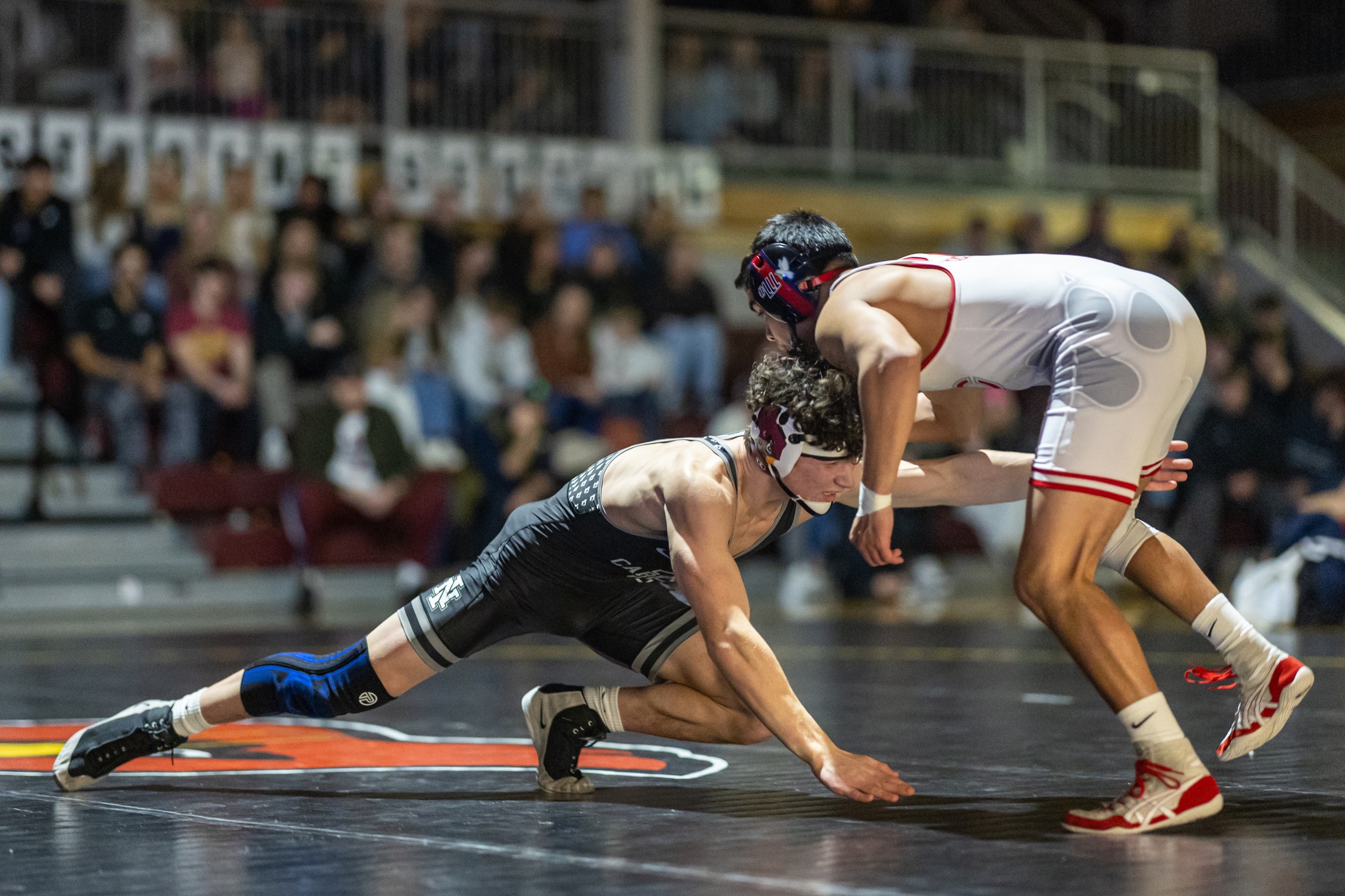 NIC wrestler attempts to take down Clackamas opponent in Christianson Gymnasium. 