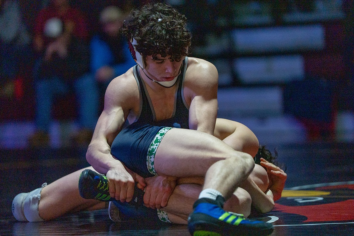 NIC ATHLETICS North Idaho College redshirt freshman Joe Sullivan attempts to grab the ankle of Big Bend wrestler Logan Bradley during their match at 149 pounds at Christianson Gymnasium on Friday. Bradley is a Coeur d'Alene High product.